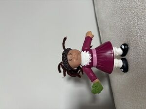Cabbage patch kids figure with a present